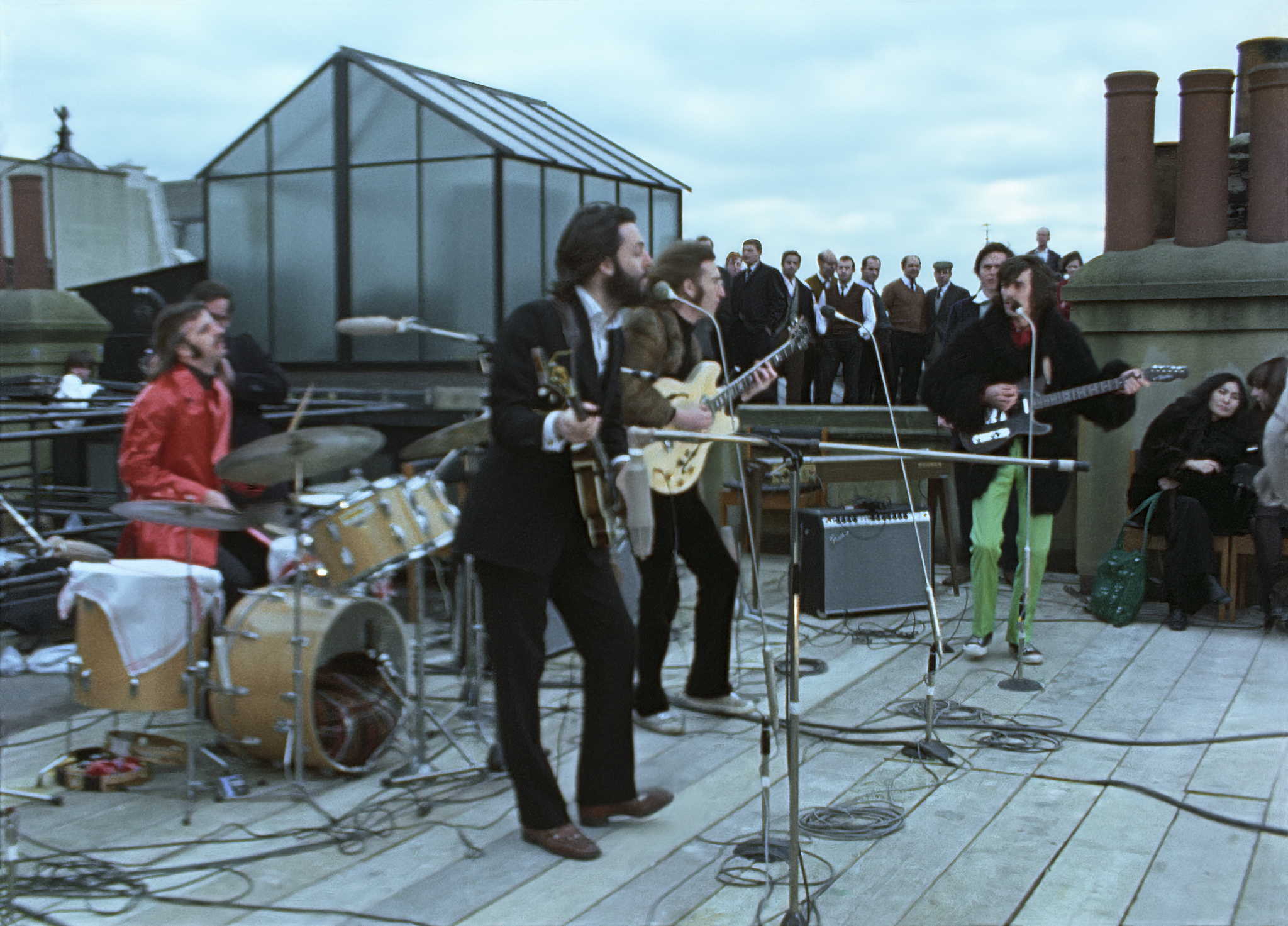 The Beatles performing on the rooftop of Apple's HQ