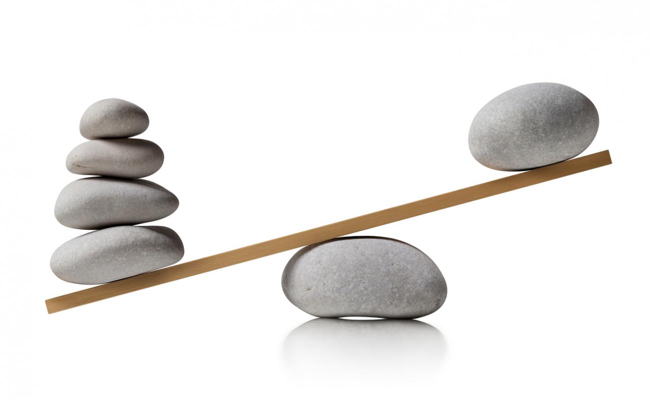 Rocks balancing on a see-saw