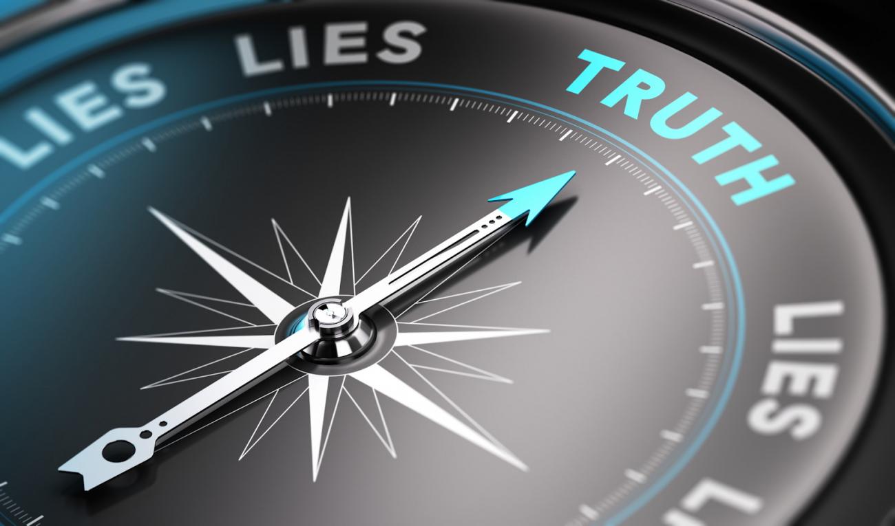 Compass dial with needle pointing towards Truth